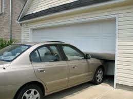 garage door broken by car